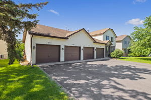 Single attached garage with driveway parking space.