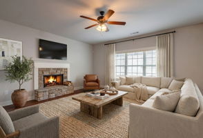 Living room w/ wood burning fireplace