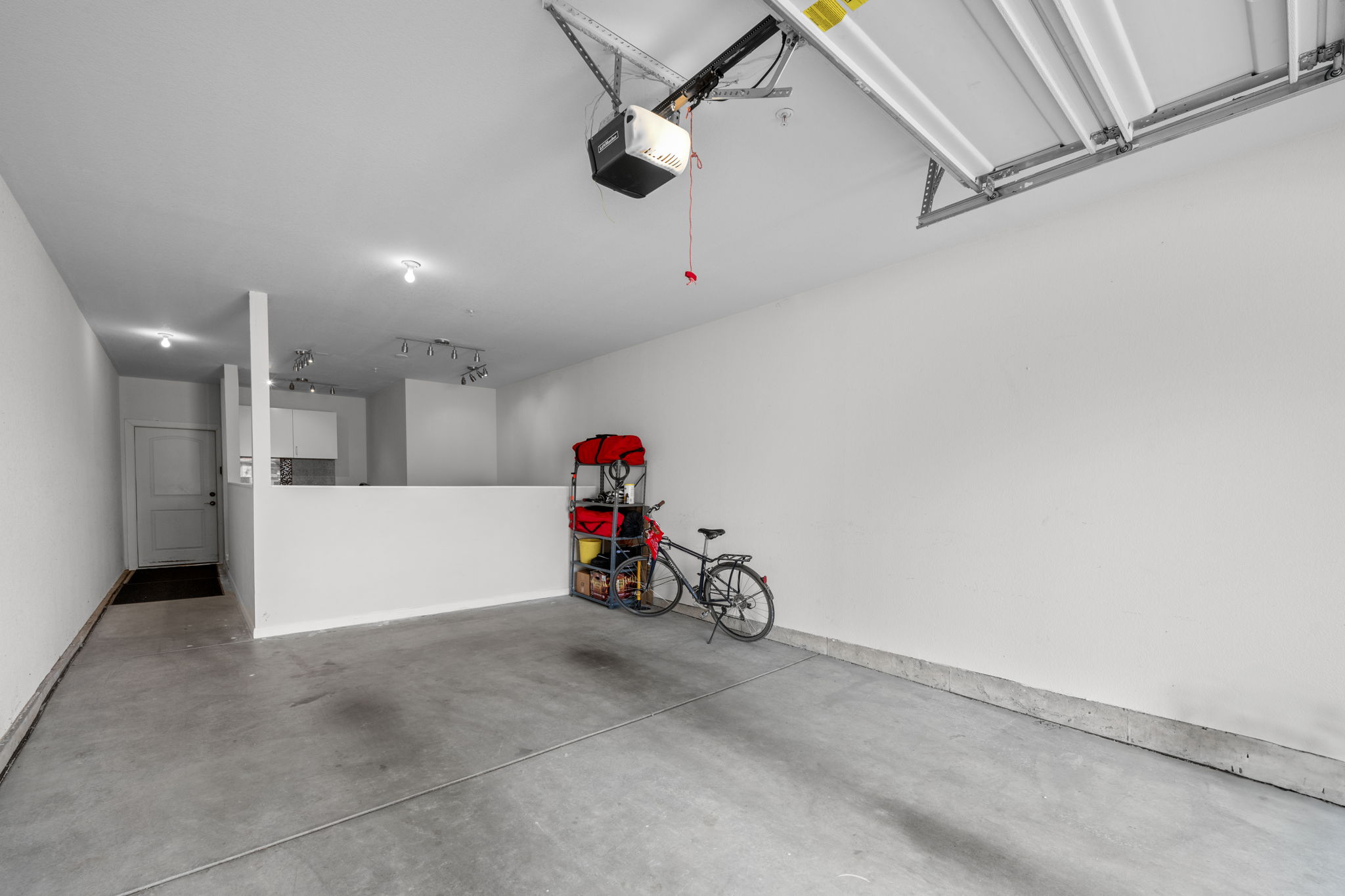 Tandem garage with bonus room, step out of garage and take 2 steps to the elevator up to your unit