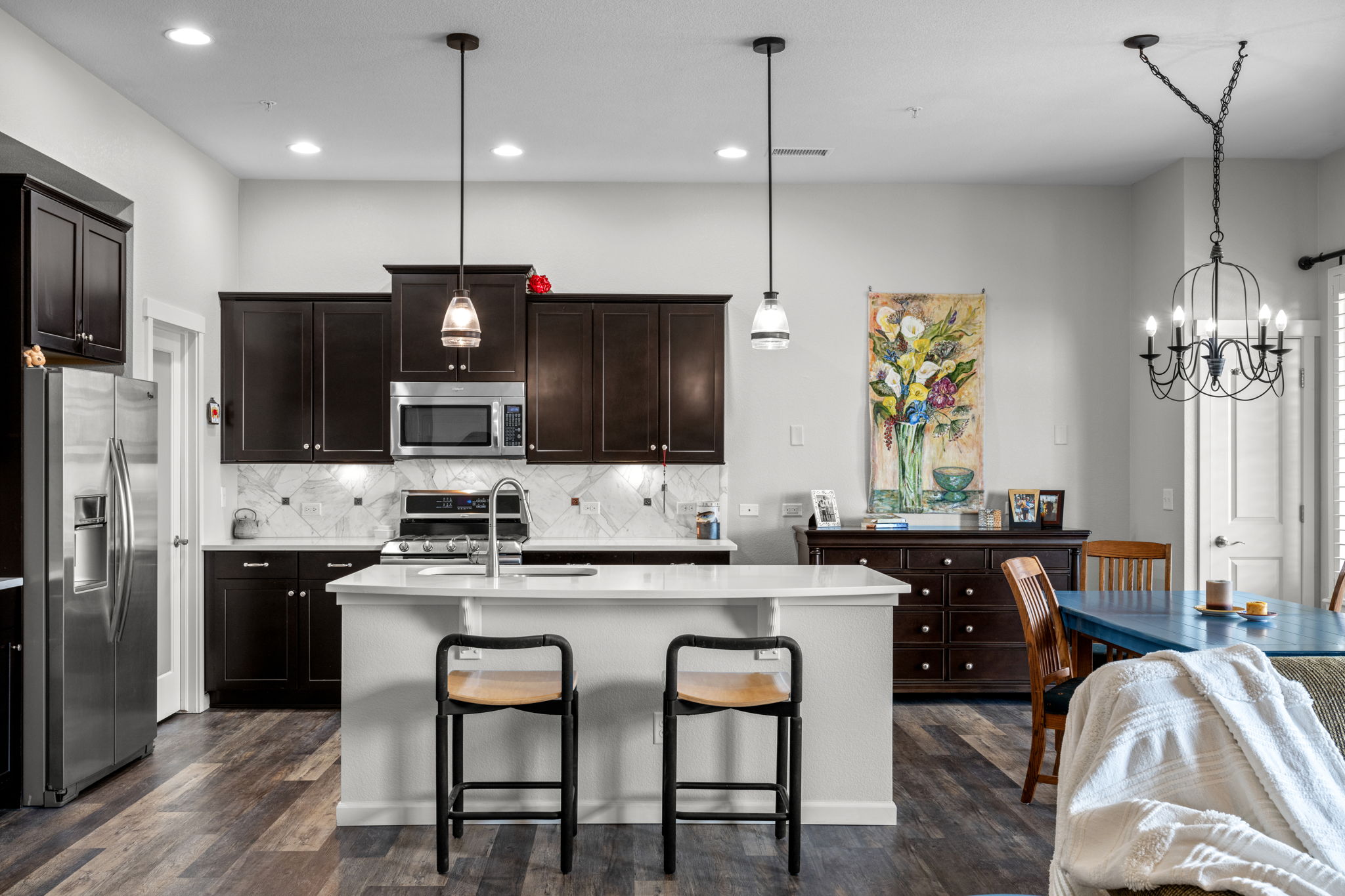 Breakfast bar & kitchen are the heart of this home