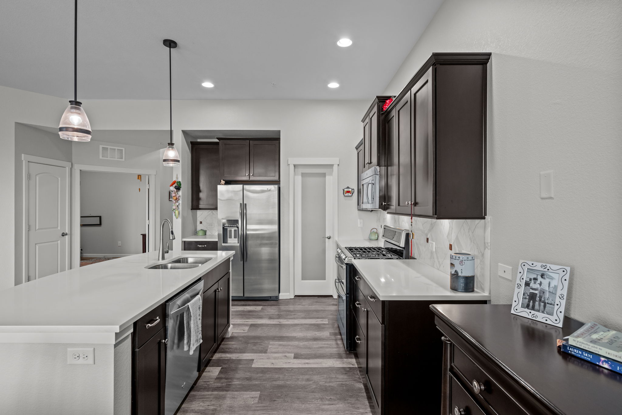 Extra view of the gourmet kitchen - note pantry and SS side by side refrigerator