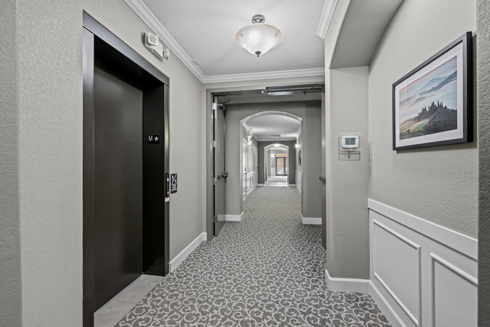 1st floor hallway with elevator between 1st & 2nd floors