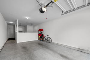 Tandem garage with bonus room, step out of garage and take 2 steps to the elevator up to your unit