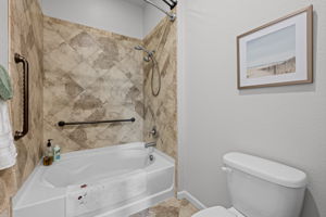 Ceramic tile extends to surrounding the garden tub