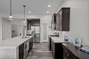 Extra view of the gourmet kitchen - note pantry and SS side by side refrigerator