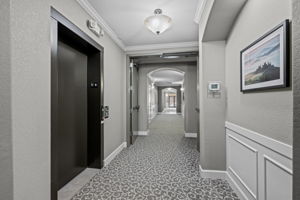 1st floor hallway with elevator between 1st & 2nd floors