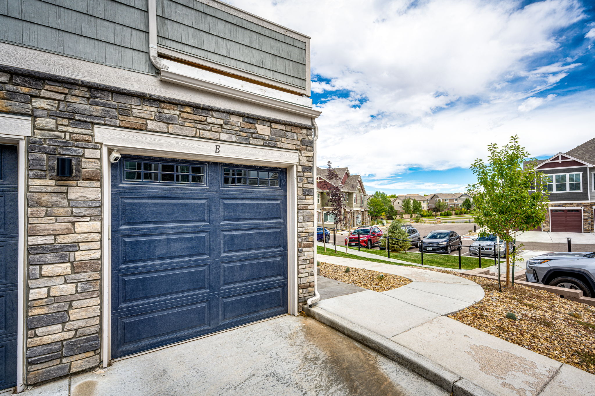 Attached oversized one car garage with 220v outlet & overhead system for storage