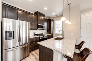 Spacious kitchen with plenty of cabinets and granite countertops