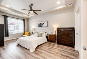 Large Primary bedroom with recessed lighting