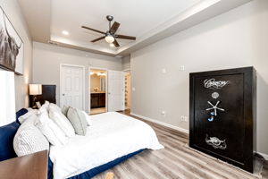 Primary bedroom with a walk-in closet