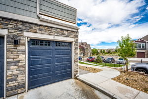 Attached oversized one car garage with 220v outlet & overhead system for storage