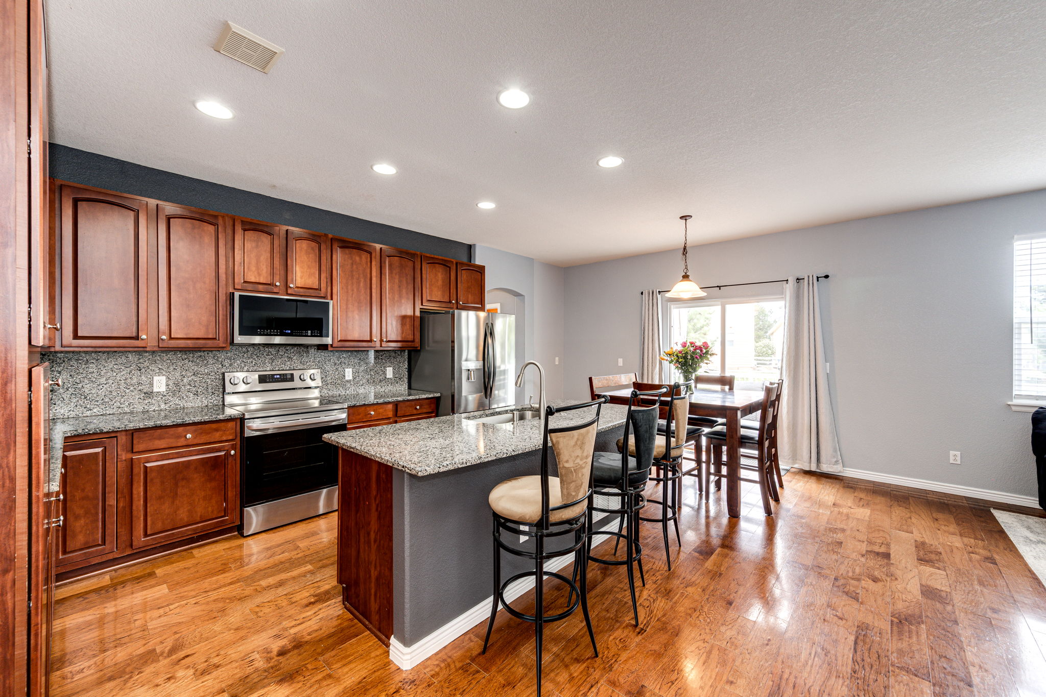 Spacious kitchen with granite countertops, stainless steel appliances and plenty of cabinets