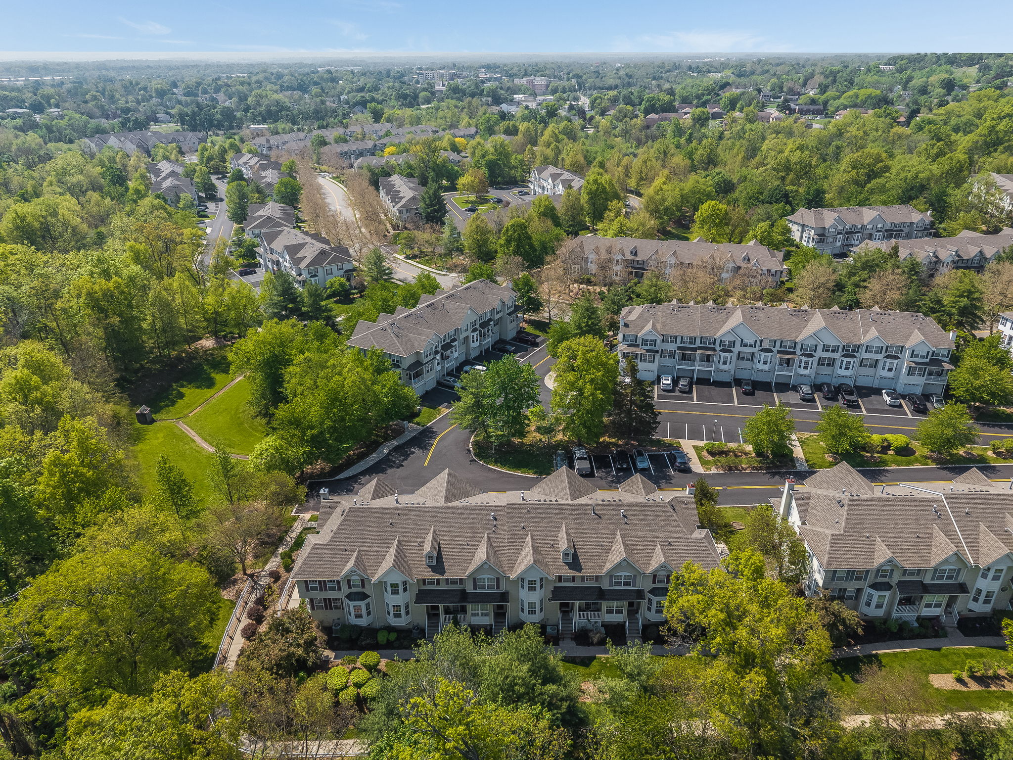 Prime location and natural wooded setting in the highly sought-after Townsende community, this Ascot model end-unit town-house offers 1,959 SF of beautifully maintained living space.