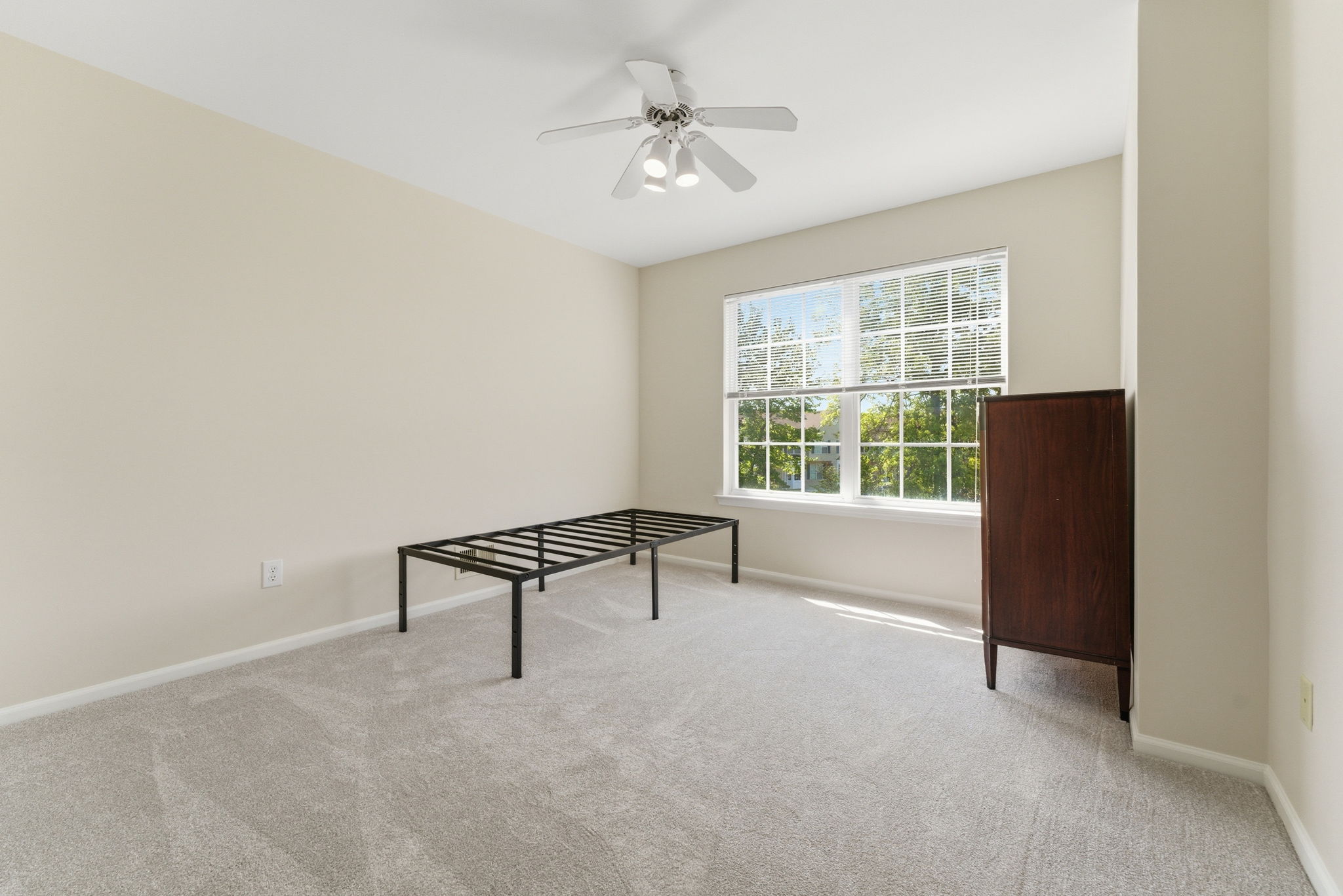 Ceiling fan, double slider closet, newer wall-to-wall carpet.