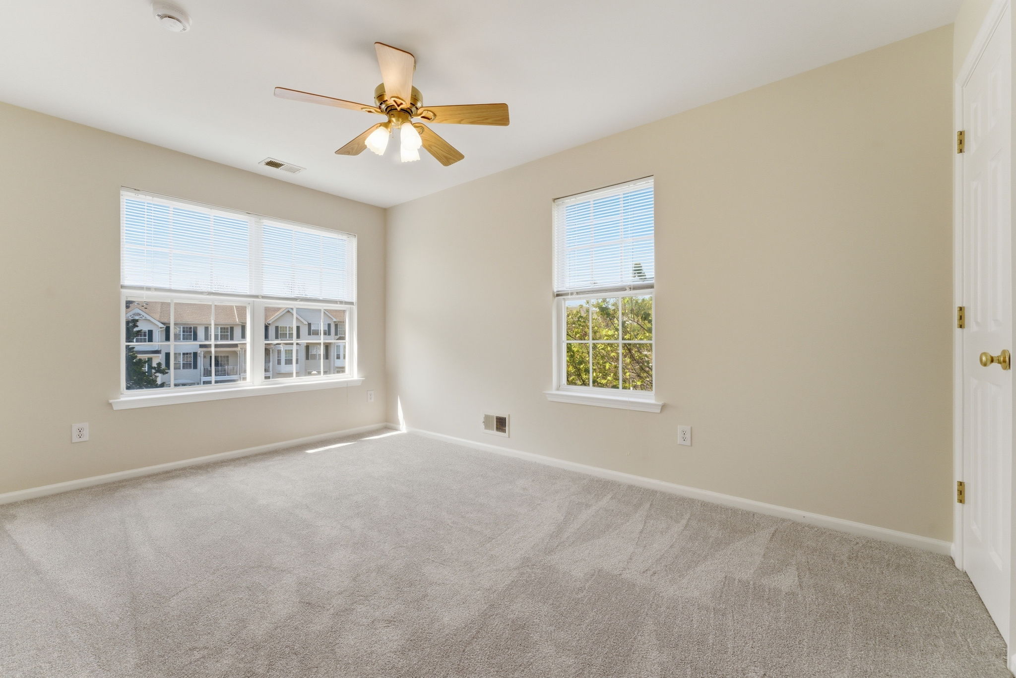 Ceiling fan, double slider closet, newer wall-to-wall carpet.