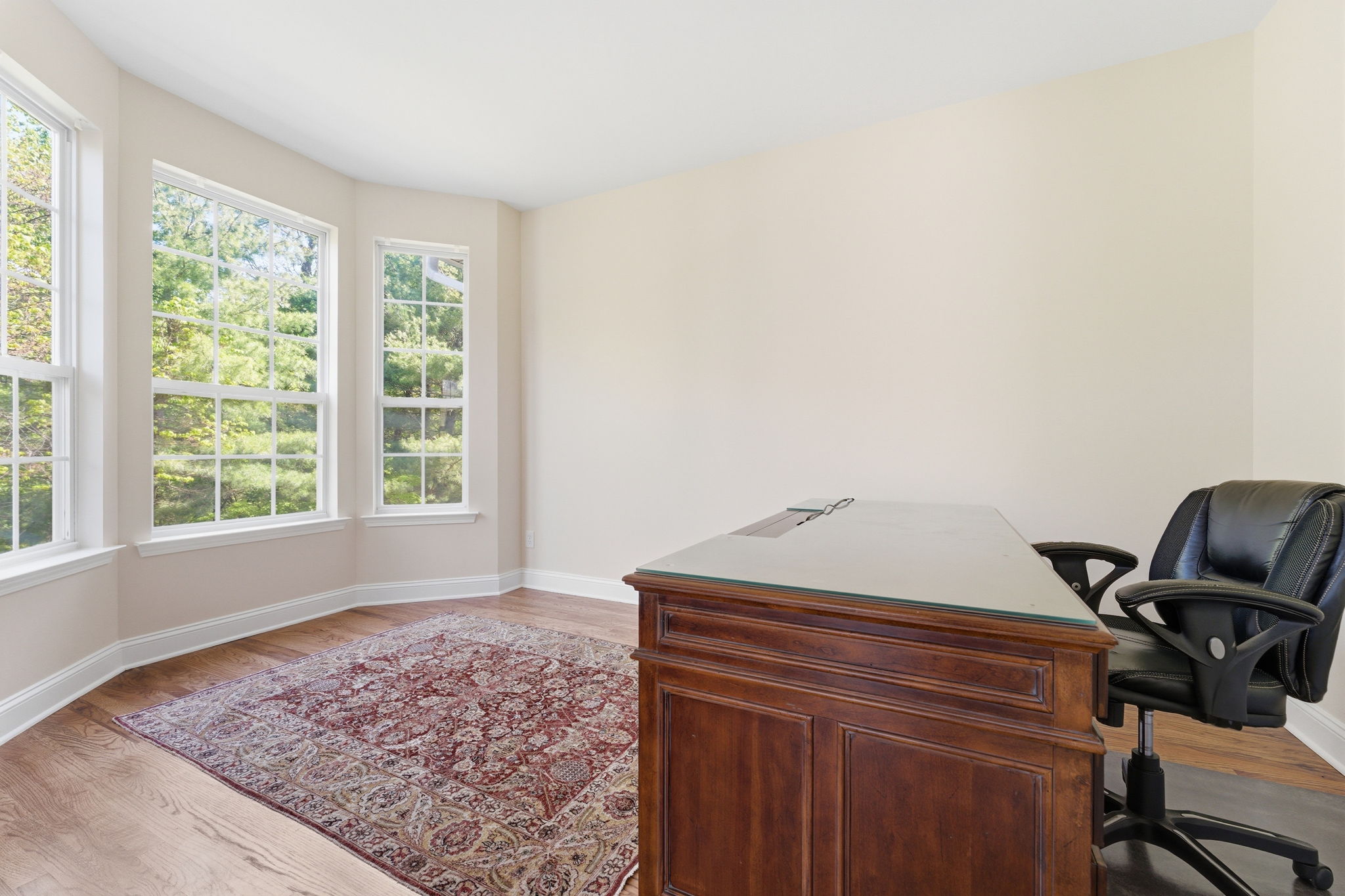 Bay window and refinished hardwood floor.