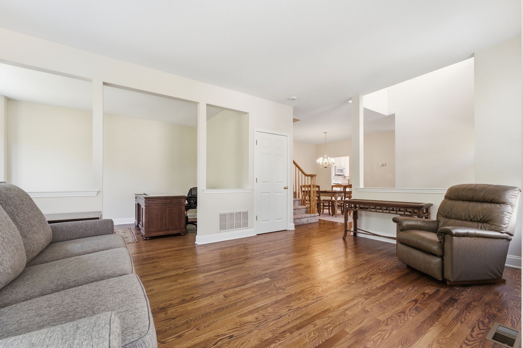 An open-concept layout filled with natural light lends an airy, welcoming feel throughout.