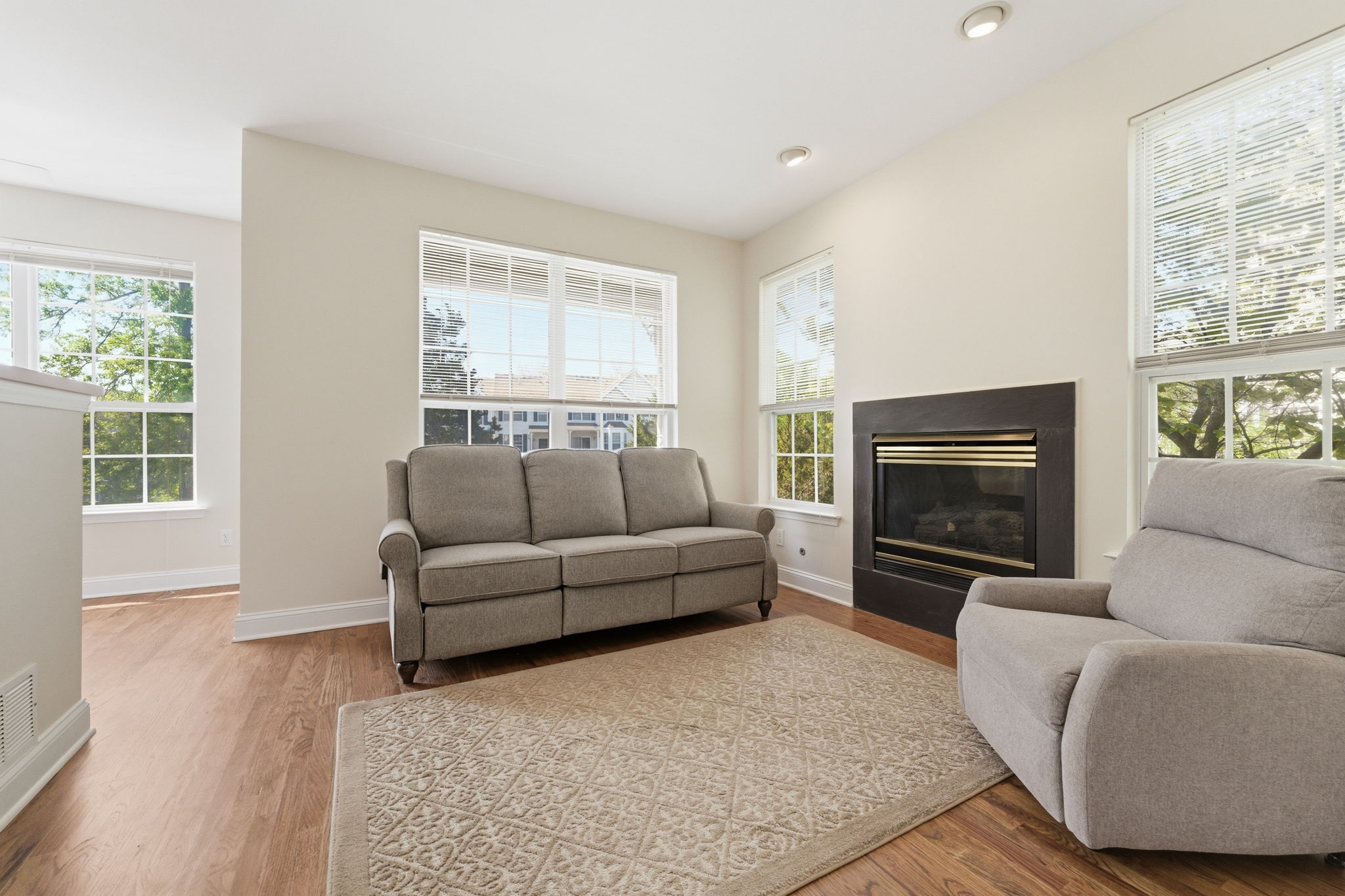 Family room features recessed lighting, a gas fireplace and refinished hardwood floor. Newer hardwood floors.