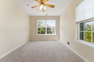 Ceiling fan, double slider closet, newer wall-to-wall carpet.