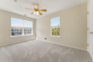 Ceiling fan, double slider closet, newer wall-to-wall carpet.