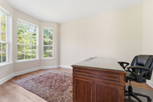 Bay window and refinished hardwood floor.