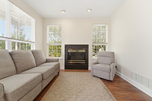 Family room features recessed lighting, a gas fireplace and refinished hardwood floor.Newer hardwood floors.