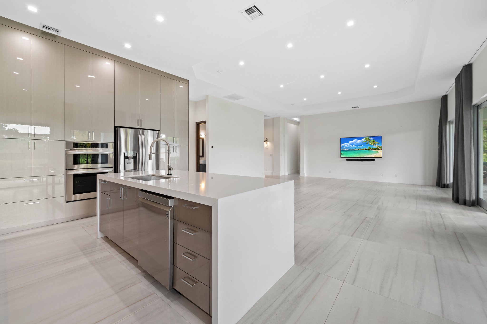 Kitchen/Grand Great Room with 48” x 48” porcelain tile flooring throughout the home