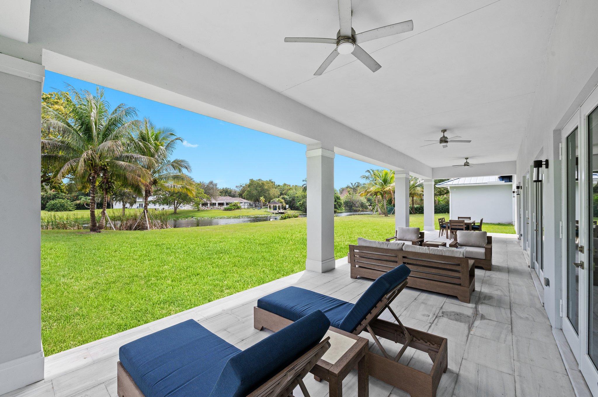 Outdoor Living Area - Covered Marble Tile Patio with 3 Ceiling Fans - Lovely Lake View