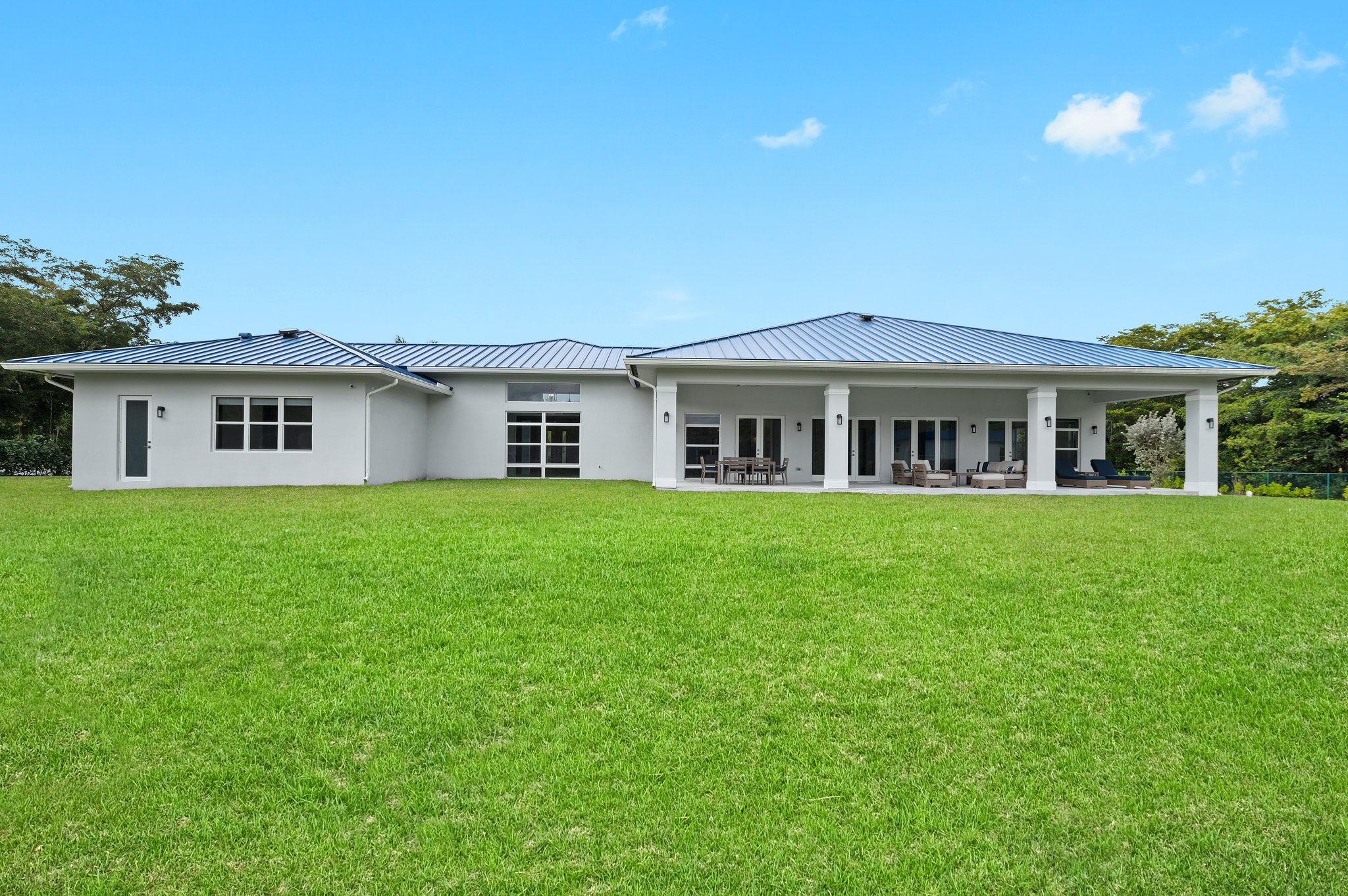 Exterior - Back - Sweeping green space—perfect canvas for resort pool, pickleball or tennis courts, soccer field, or equestrian lifestyle