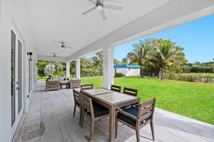 Outdoor Living Area - Covered Marble Tile Patio with 3 Ceiling Fans