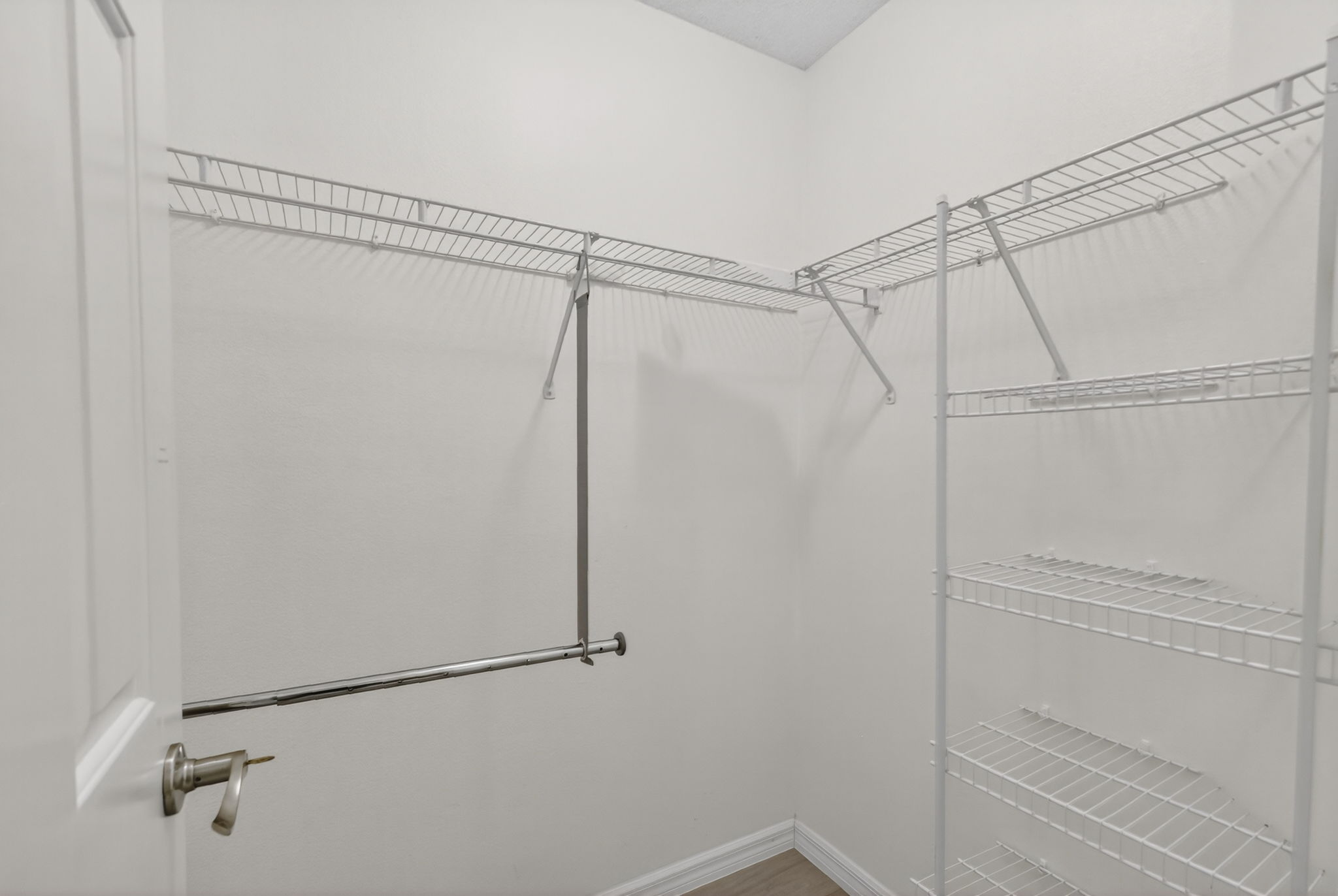 Primary Bedroom First Walk-In Closet