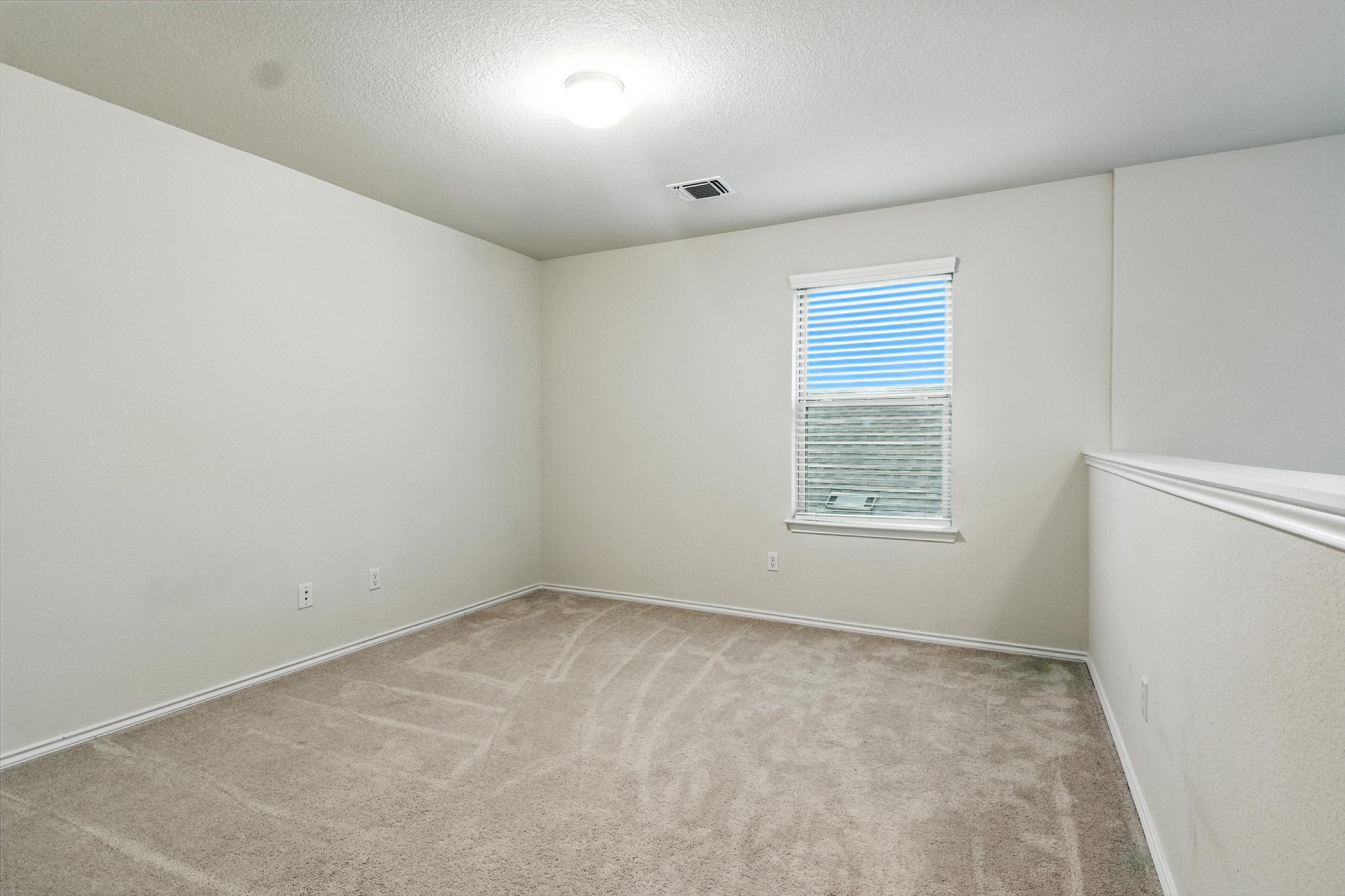 The upstairs gameroom is perfect for work or play.