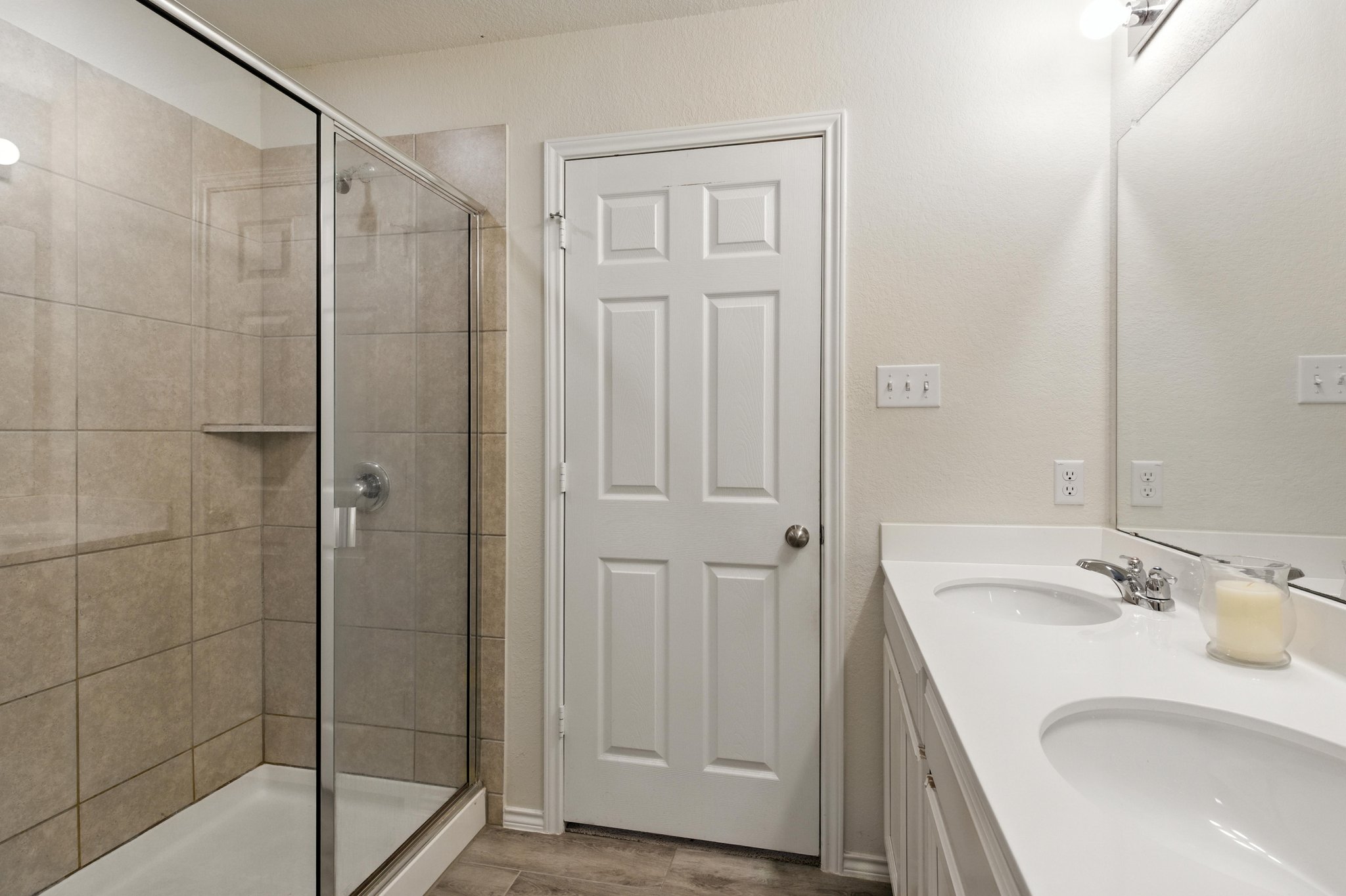 The lavish owner's bath also features a large custom shower.