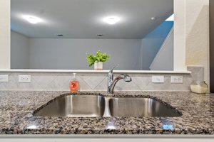 The kitchen overlooks the family room here.