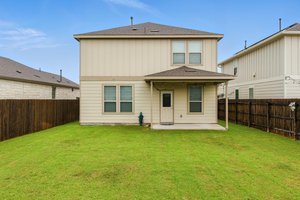 Enjoy the great outdoors in comfort under the shade of the covered patio.
