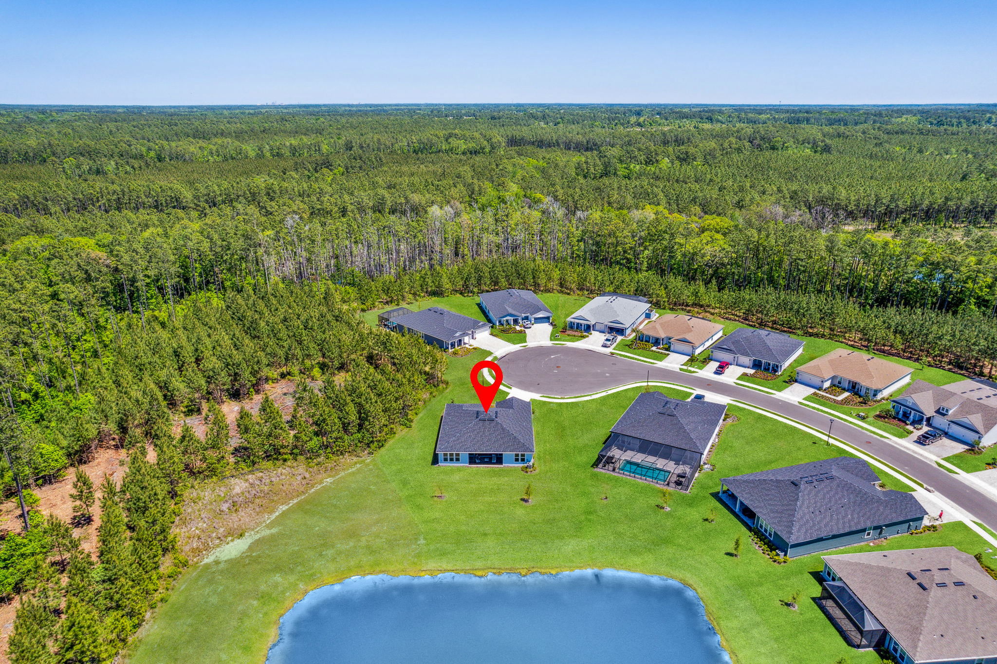 ... and bordered by several acres of protected lake and preserves.