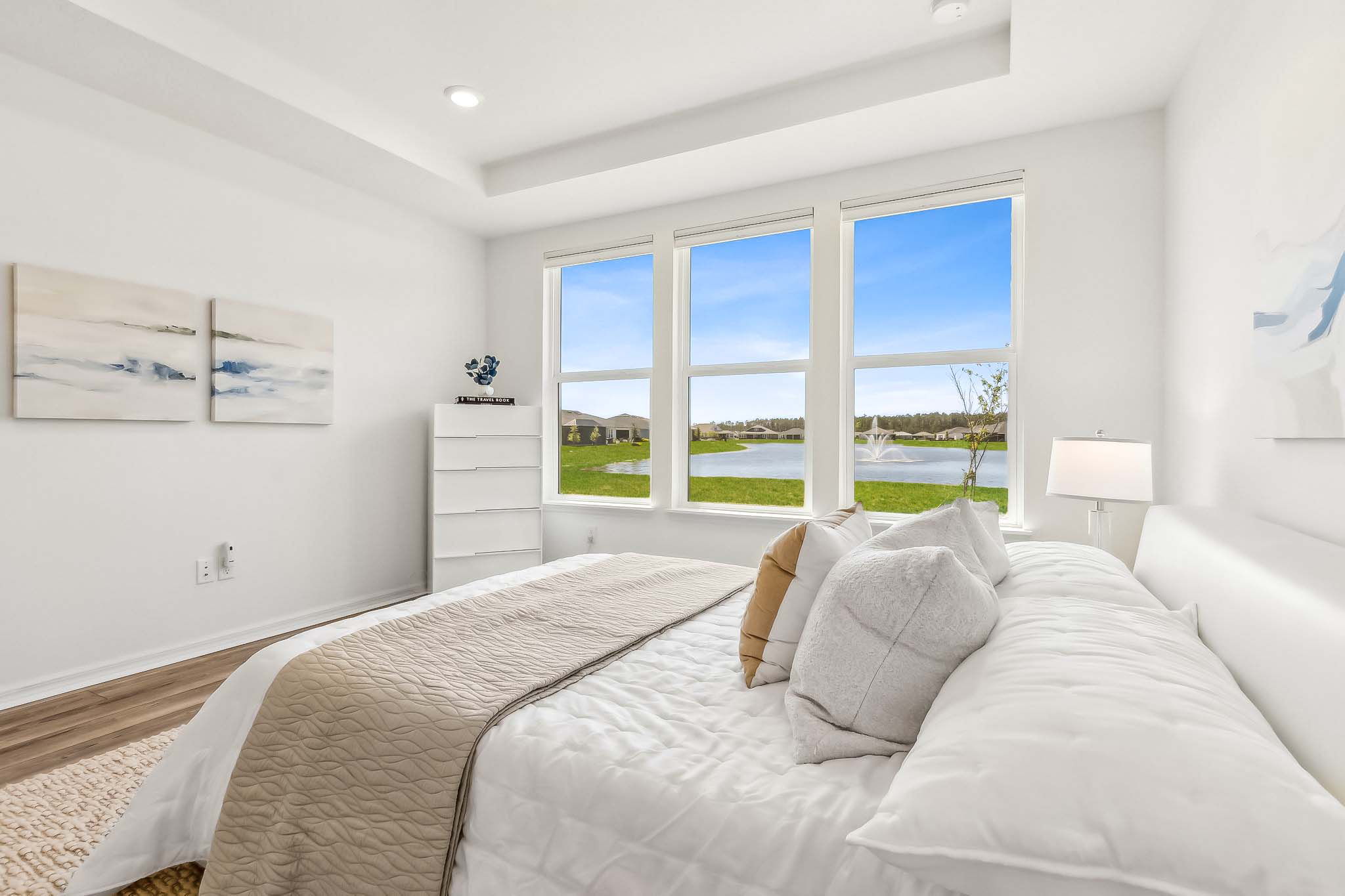 With a wall of windows framing the scenic pond ...