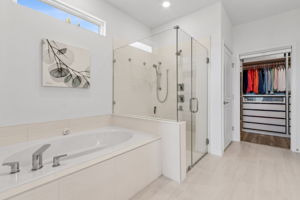 ... ...showcasing a tastefully upgraded tub and shower...
