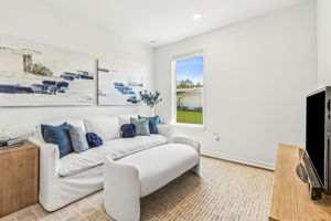Currently styled as a secondary living area, this is the third guest bedroom.