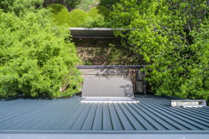 38 Aerial Exterior Front Partial w Balcony + Yard Bird's Eye View