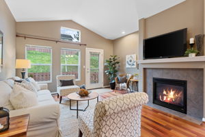 Cozy living room with gas fireplace with access to patio!
