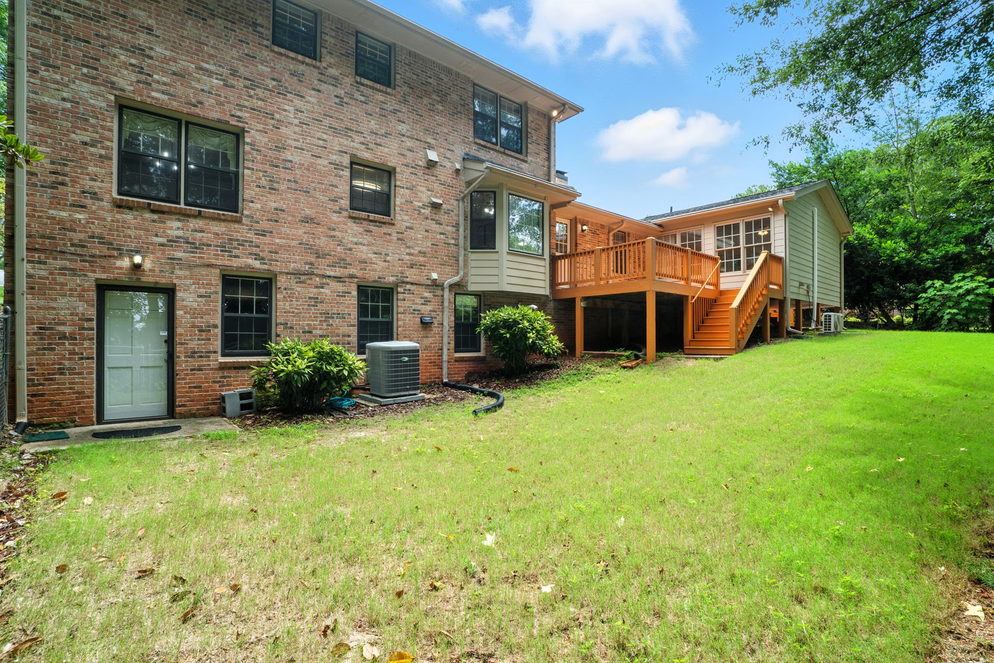 Back of House with Deck & Sun Room View
