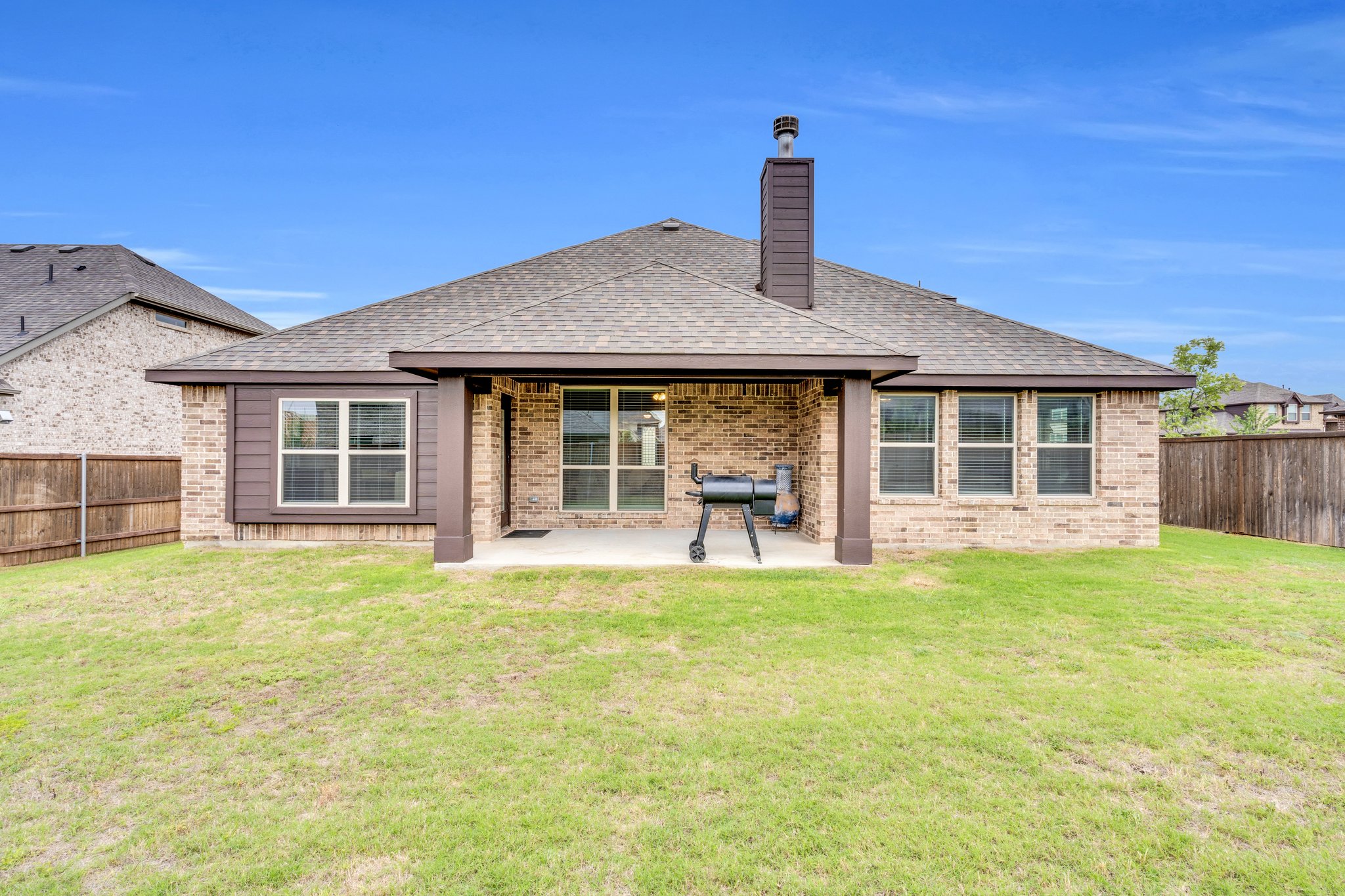 This home includes an extended covered patio with plenty of space for outdoor grilling and entertaining