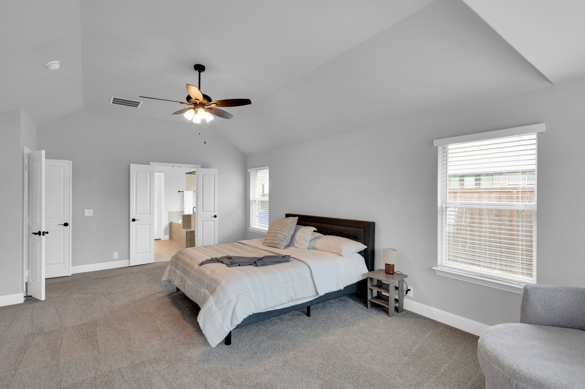 Window treatments include wooden 2" blinds for privacy in all rooms