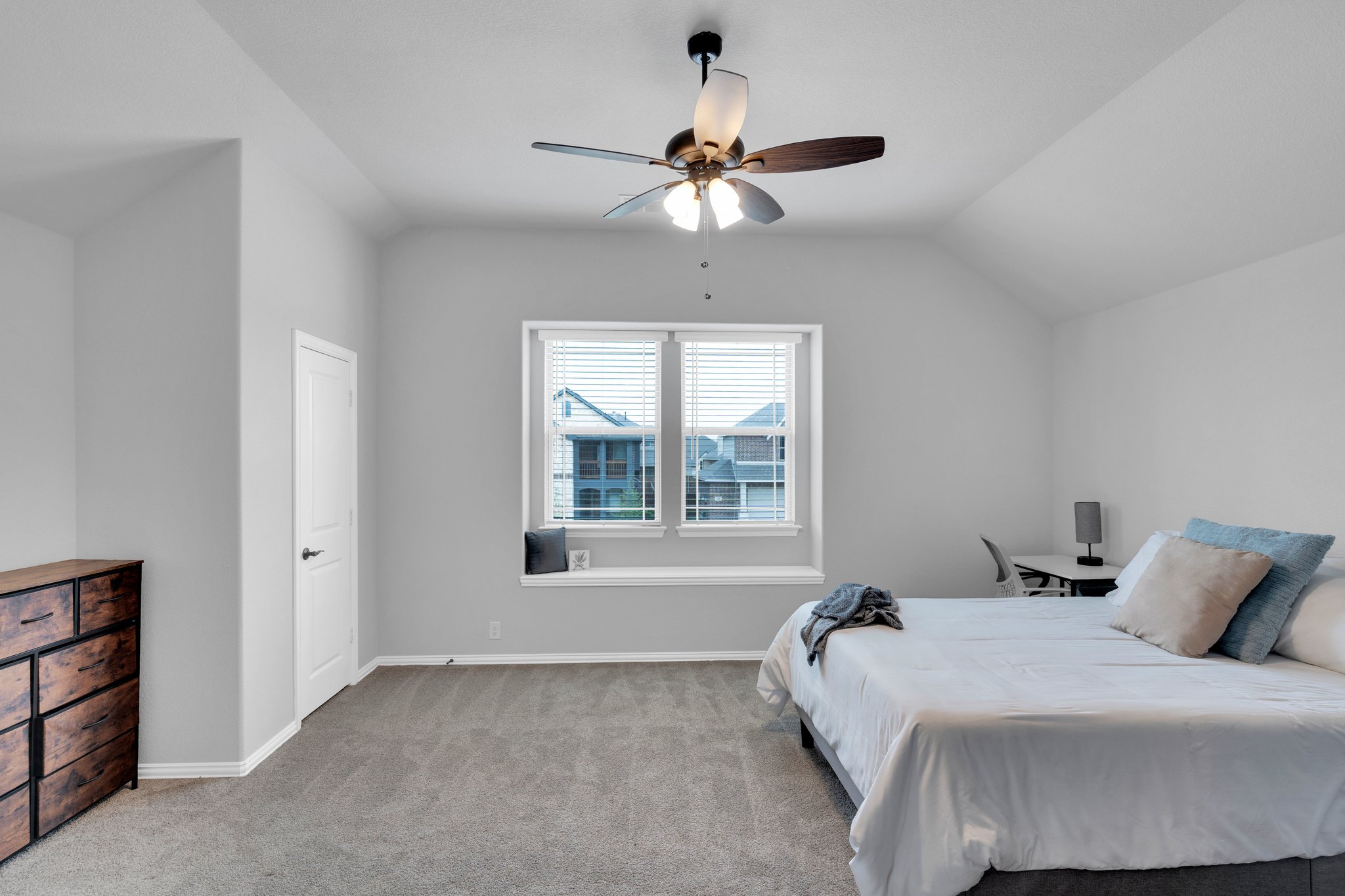 Your largest secondary bedroom enjoys privacy upstairs with a window seat, double closets, and its own full bath