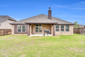 This home includes an extended covered patio with plenty of space for outdoor grilling and entertaining