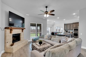 Stunning options such as wood tile floors in downstairs common areas and stone-to-cedar mantel fireplace in the living room enhance the home's appeal