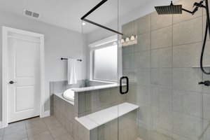 Natural lighting brings out the best in this luxurious primary bath