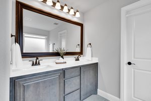 Your ensuite hosts a massive walk-in closet and dual sinks with plenty of storage