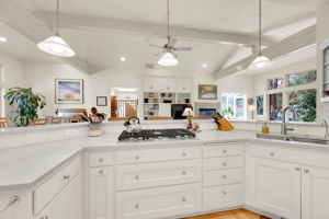 Solid Surface Counters, Newer Gas Cooktop and Downdraft Vent (2022)